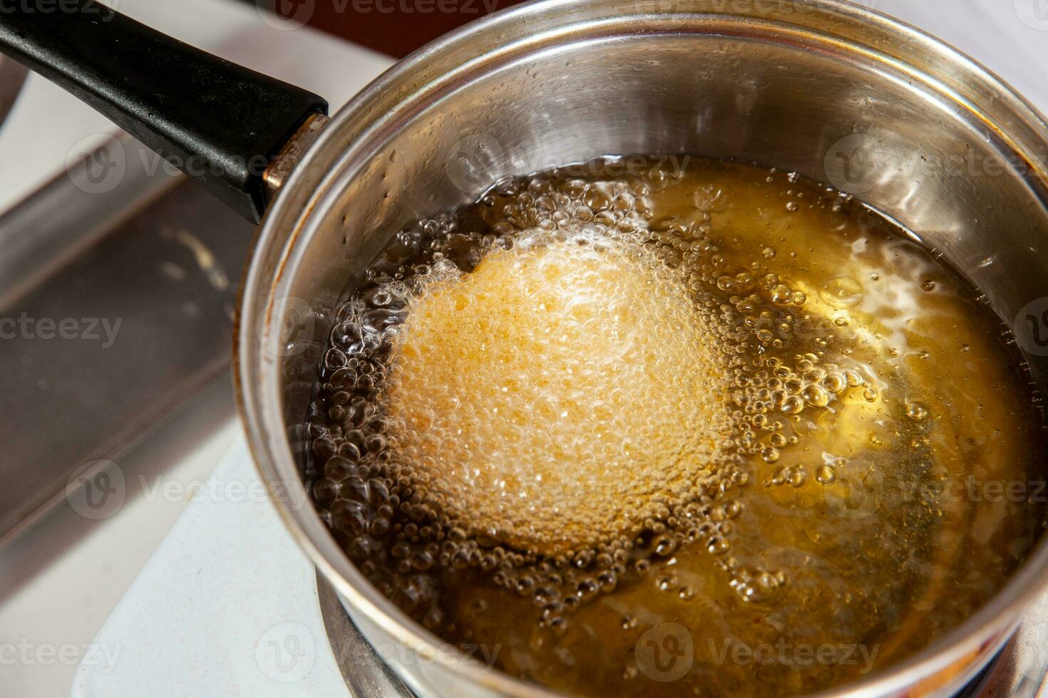 Preparation of the traditional dish from the Caribbean Coast in colombia called Arepa de Huevo or egg arepa photo