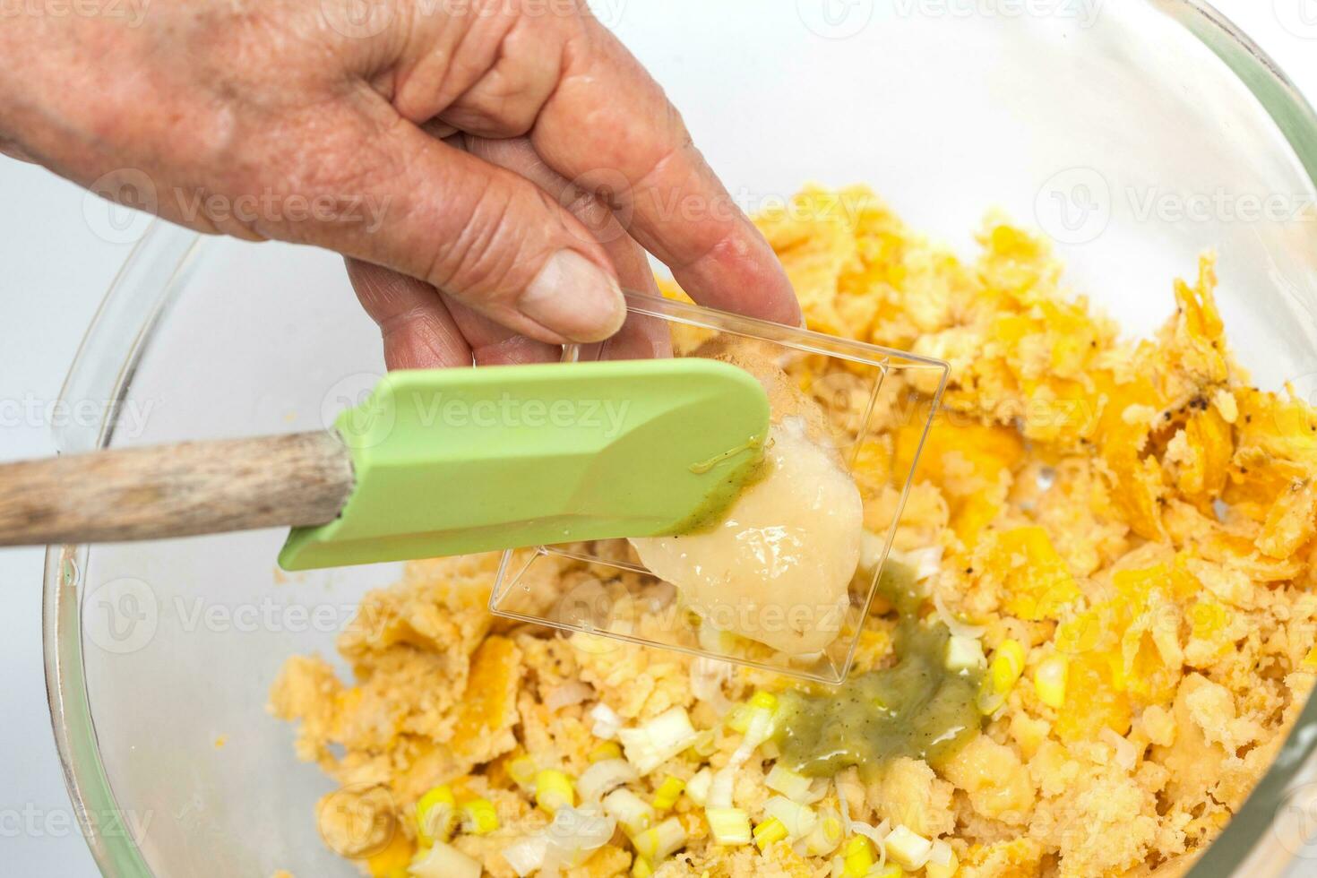 Preparation of plantain dough. Preparation of plantain croquettes stuffed with pork cracklings. Marranitas or puerquitas. photo