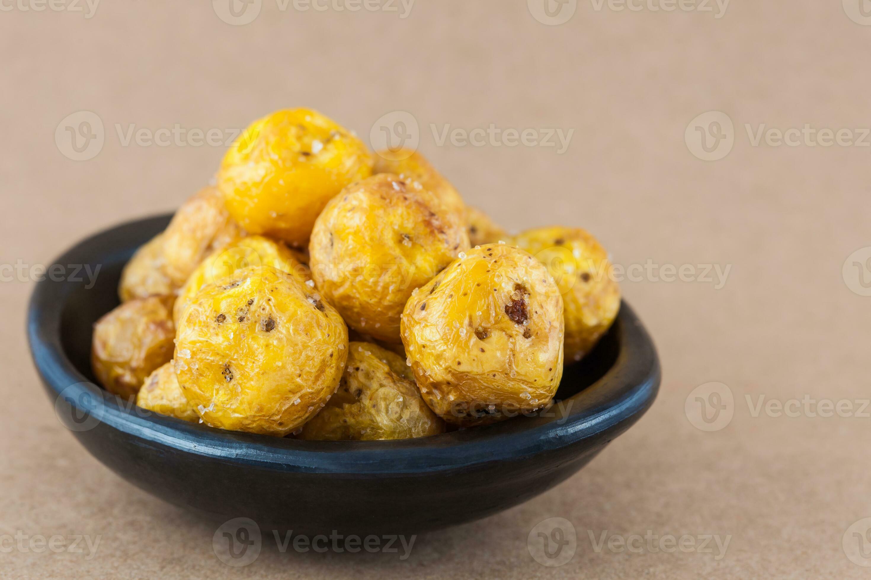 Fried yellow potato isolated in beige background. Fried yellow potato