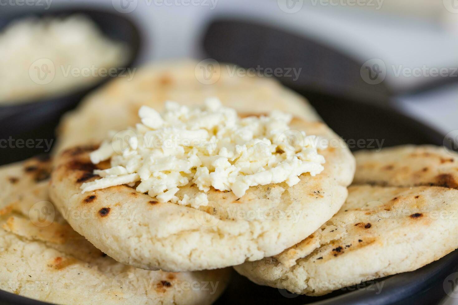 Traditional Colombian white corn arepa with cheese photo