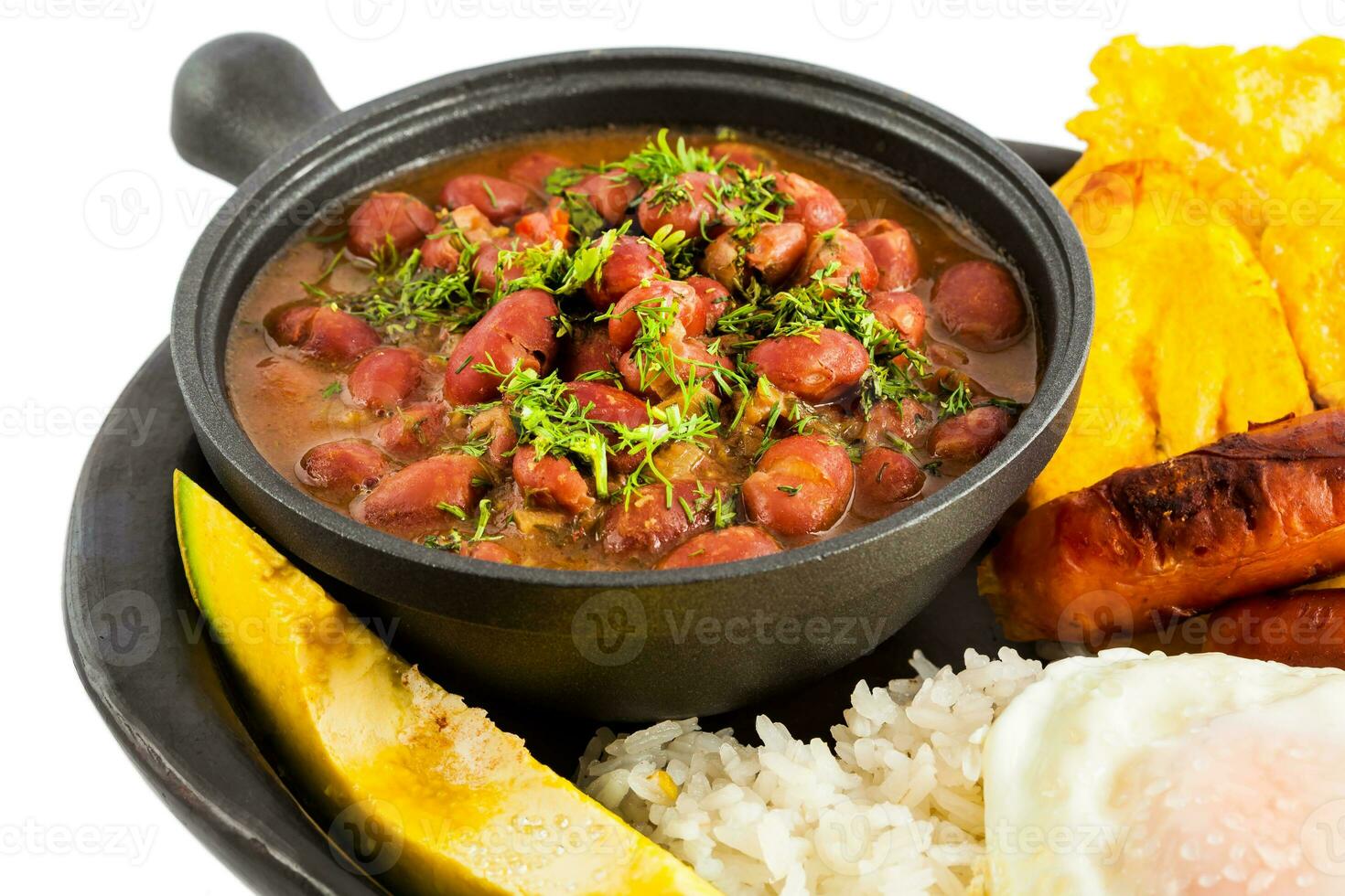 Traditional Colombian dish called Banda paisa a plate typical of Medellin that includes meat, beans, egg and plantain photo