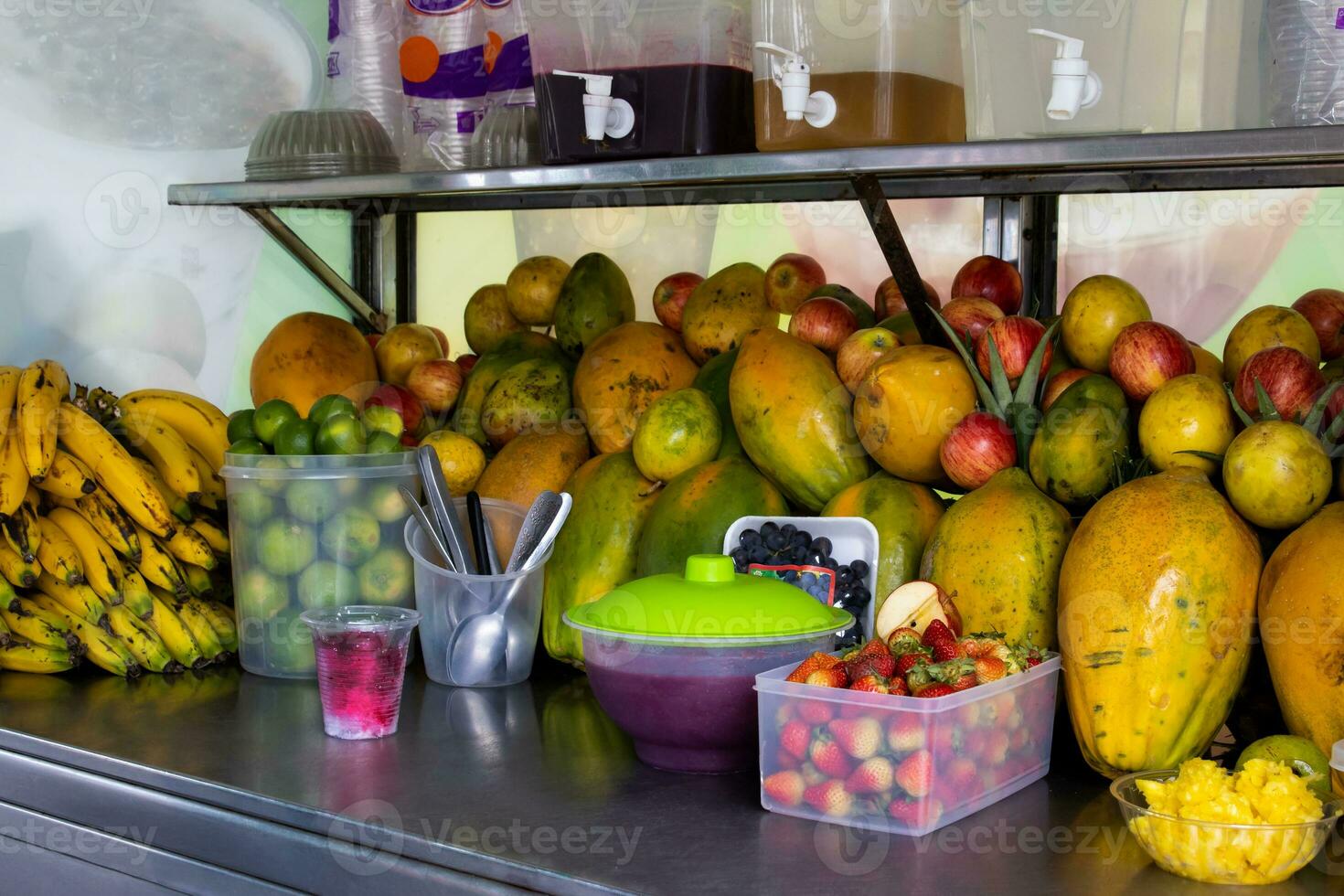 Preparation of a traditional sweet water ice with fruits called cholado in the city of Cali in Colombia photo