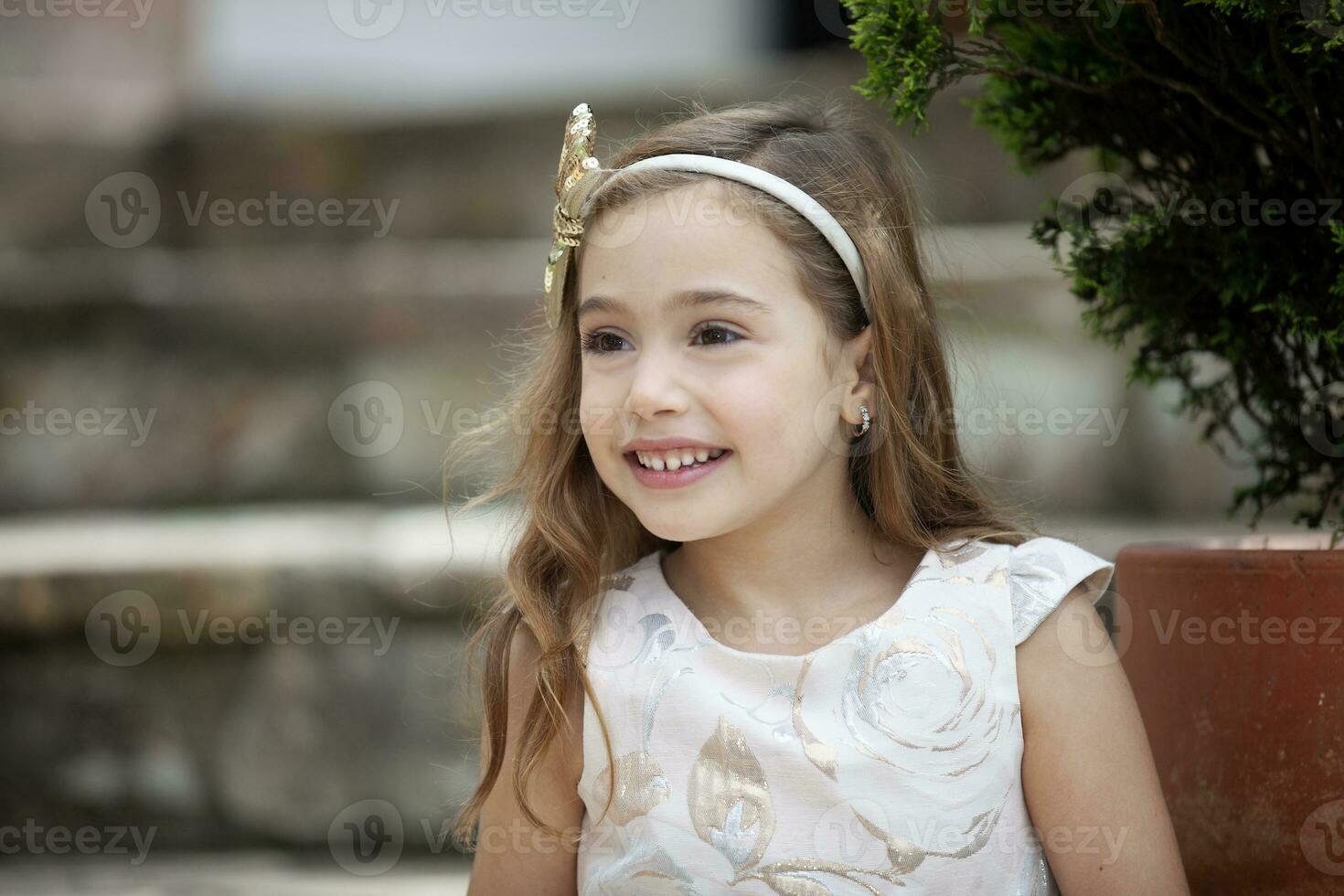 Sweet six years old blonde girl outdoors photo