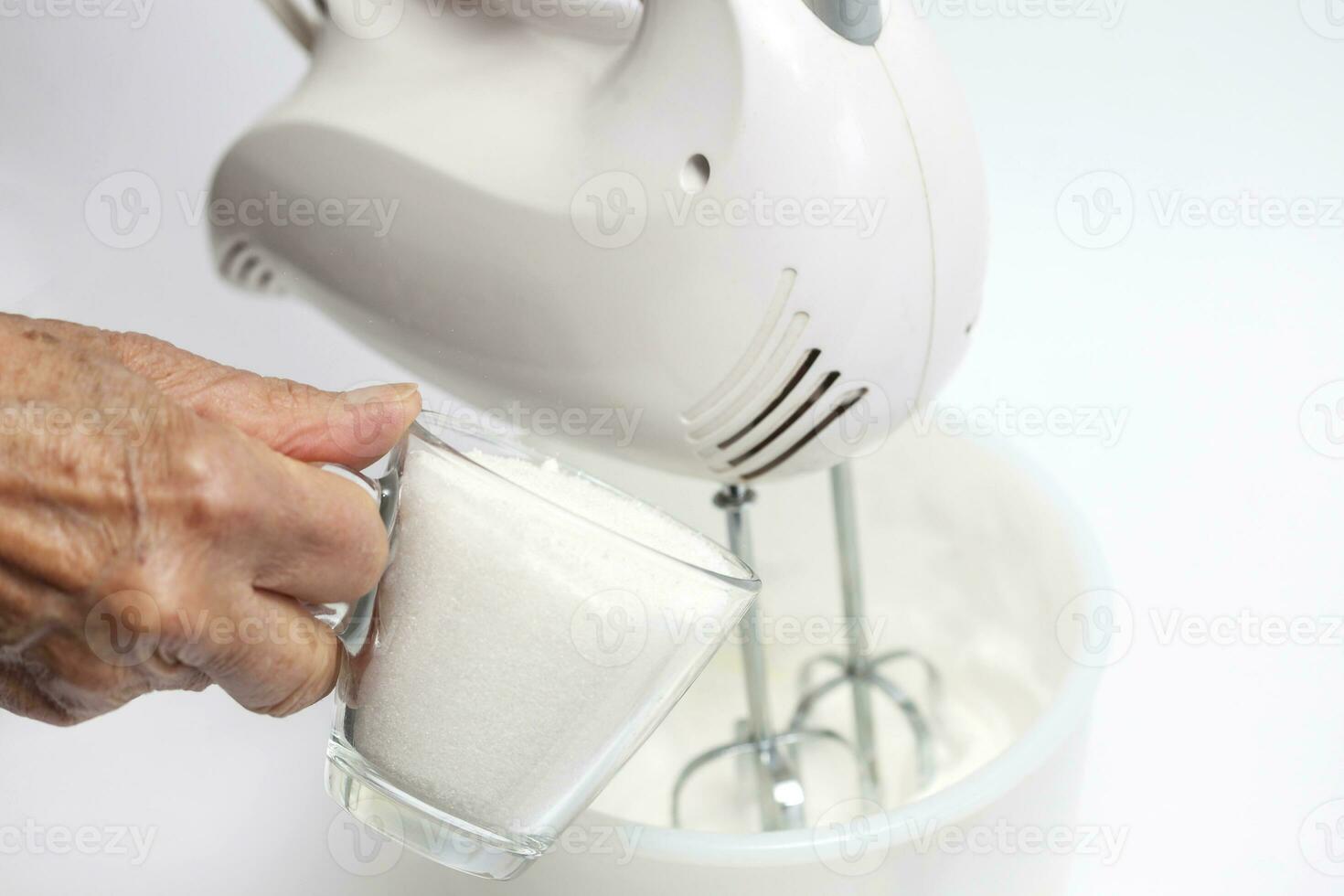 Adding sugar to egg whites snow photo