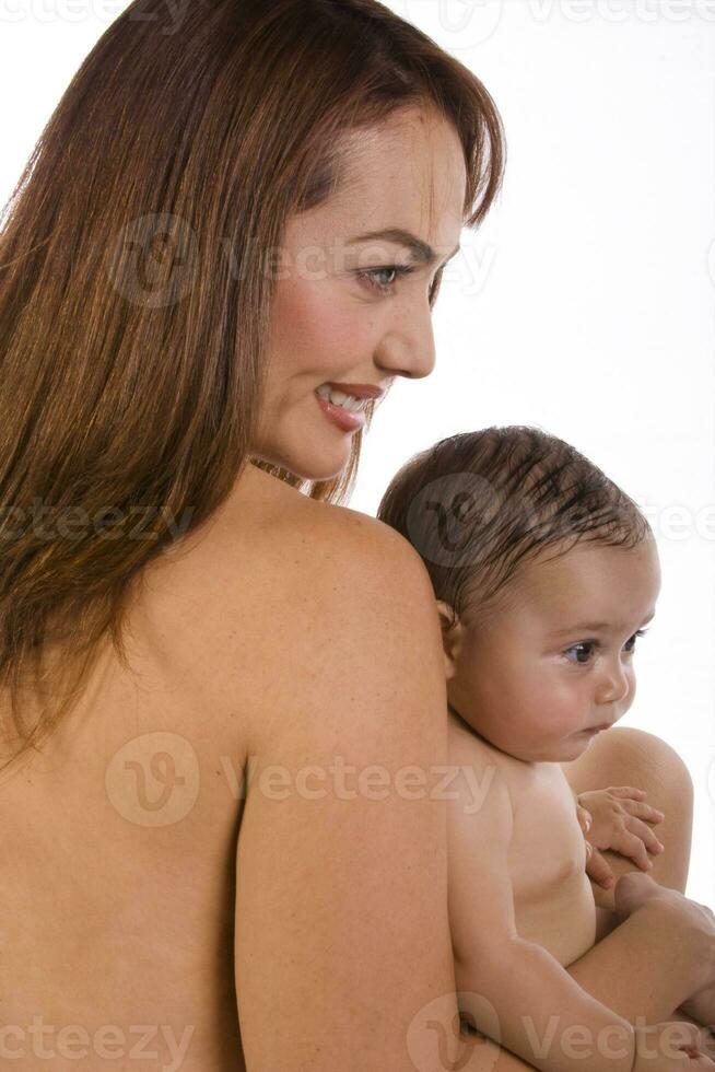 Happy beautiful young mother and her baby girl on white background photo