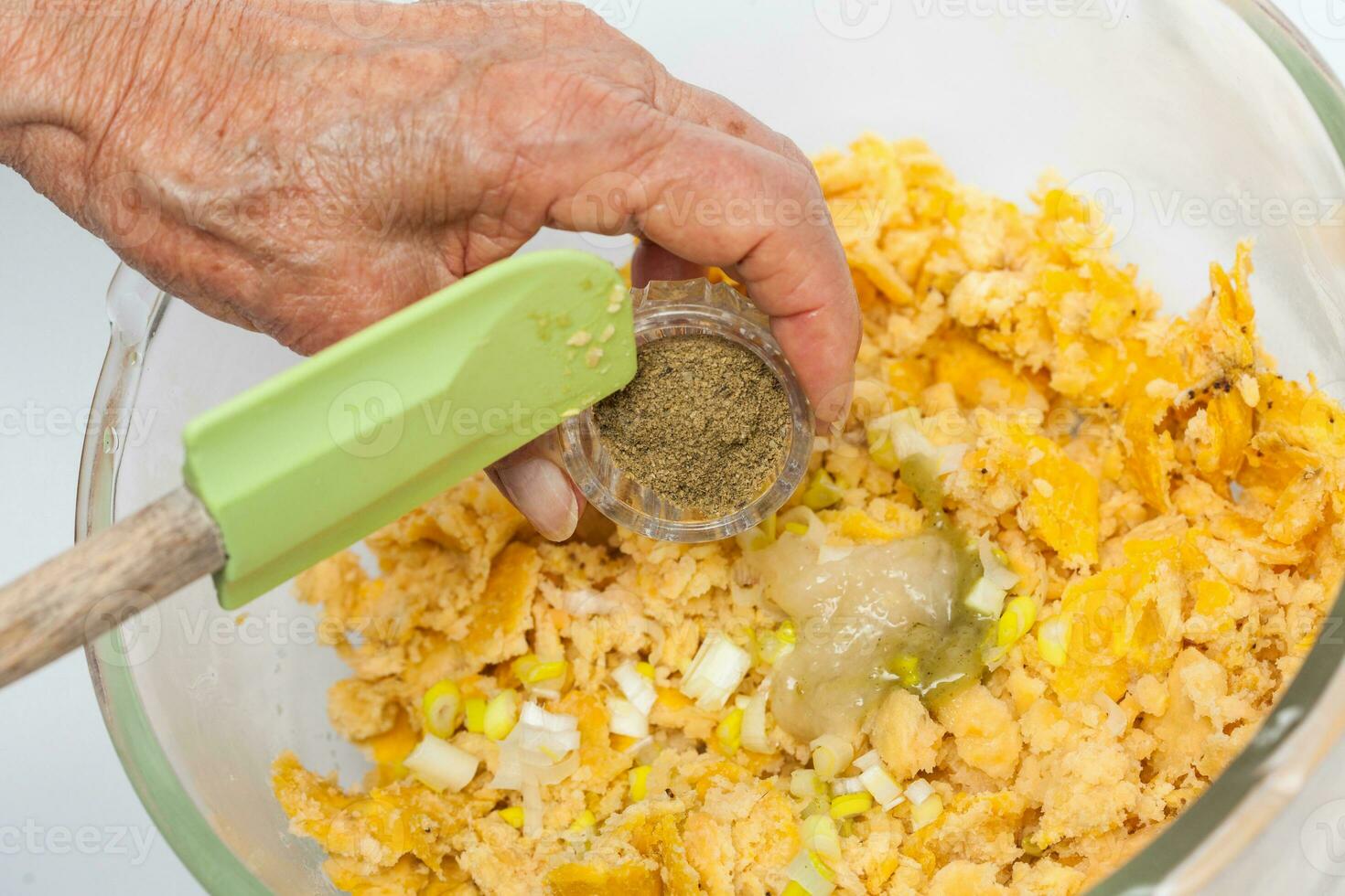 Preparation of plantain dough. Preparation of plantain croquettes stuffed with pork cracklings. Marranitas or puerquitas. photo