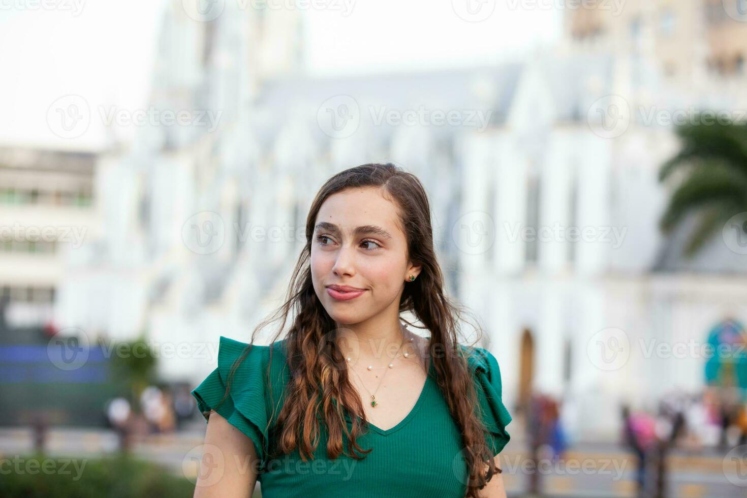 Beautiful tourist girl at the Ortiz Bridge with La Ermita church on background in the city of Cali in Colombia photo