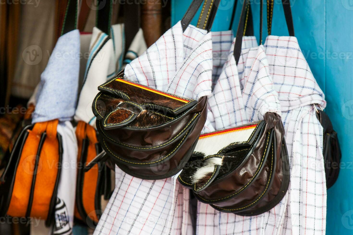 Colombian traditional leather satchel from the Antioquia Region called Carriel and poncho photo