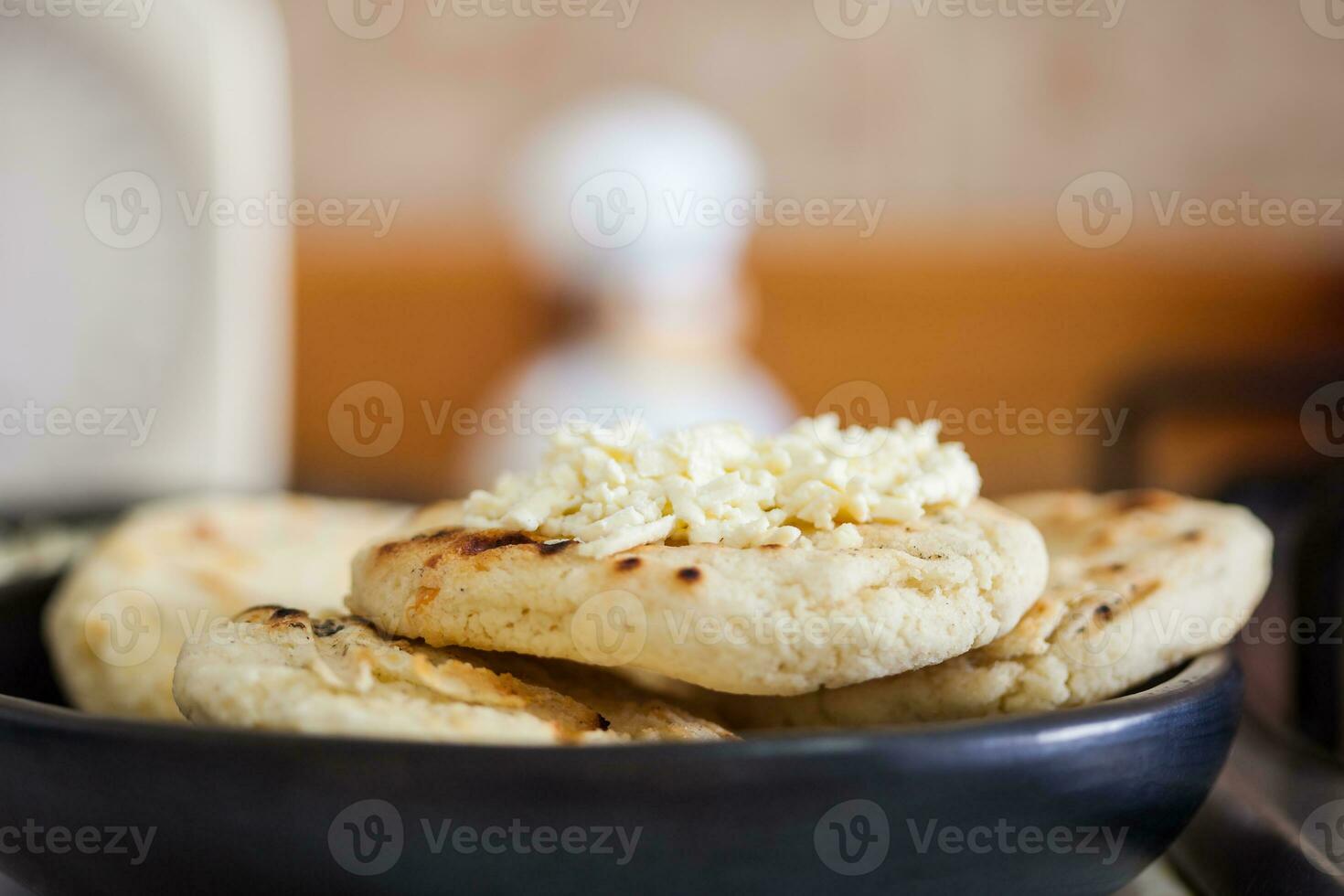 Traditional Colombian white corn arepa with cheese photo