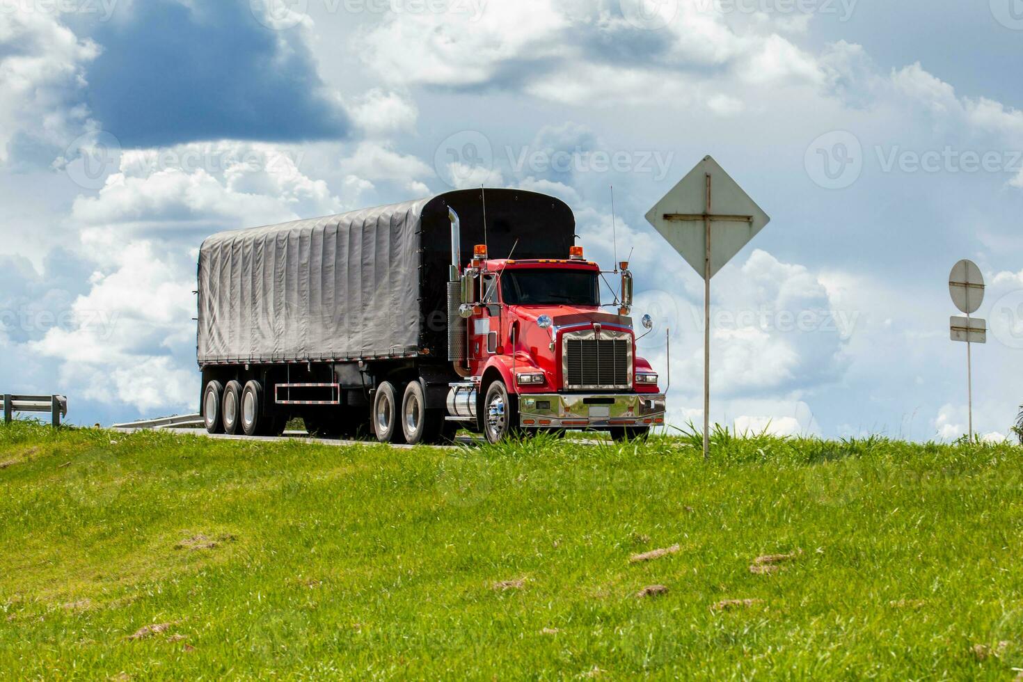 Red cargo truck on the roads of the region of  valle del cauca in Colombia photo