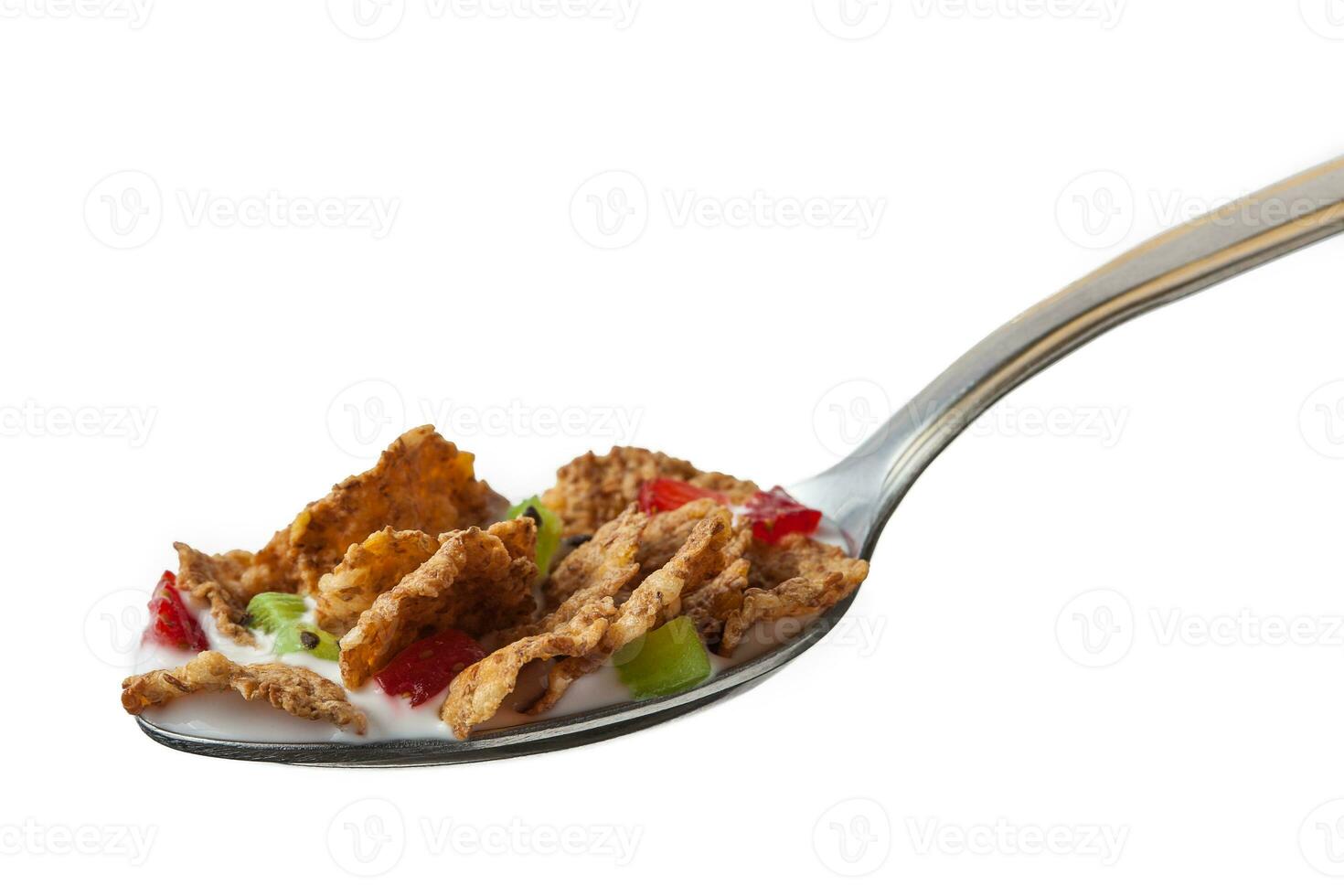 Spoon of cereal with milk, strawberries and kiwi photo