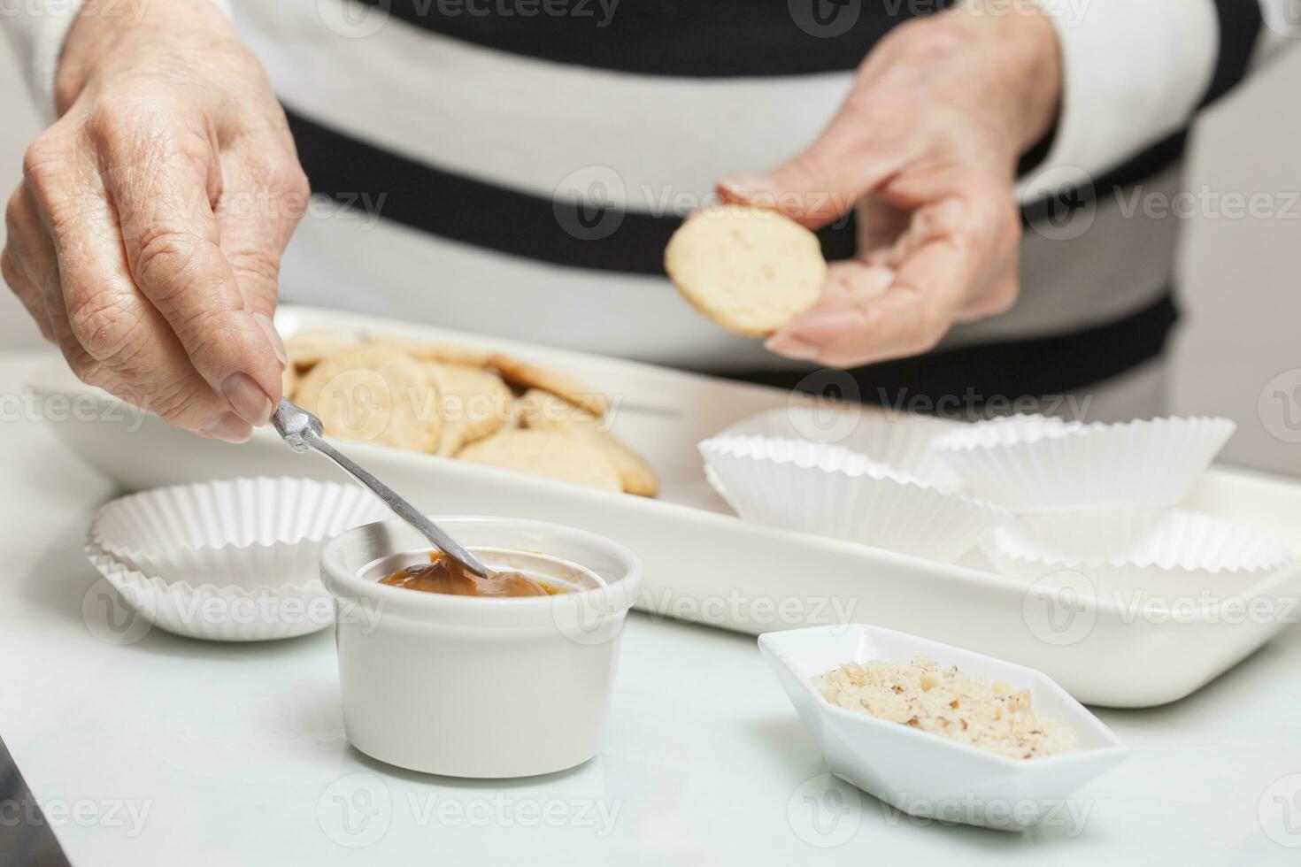 Filling cookies with caramelised milk photo