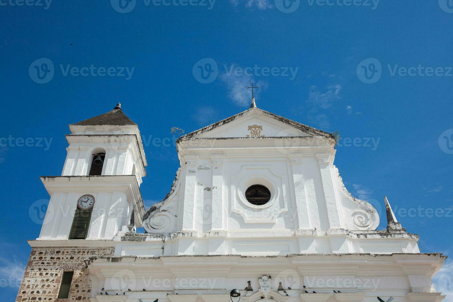 The historical Cathedral Basilica of the Immaculate Conception built between 1797 and 1837 in the beautiful town of Santa Fe de Antioquia in Colombia photo