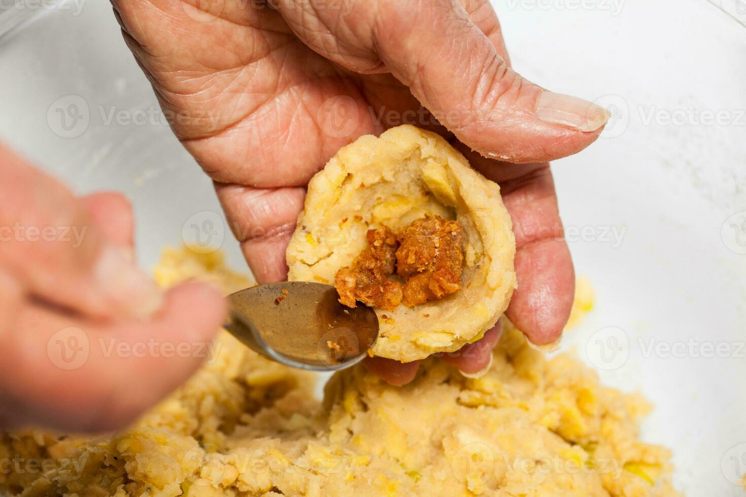 Preparation of plantain croquettes stuffed with pork cracklings photo