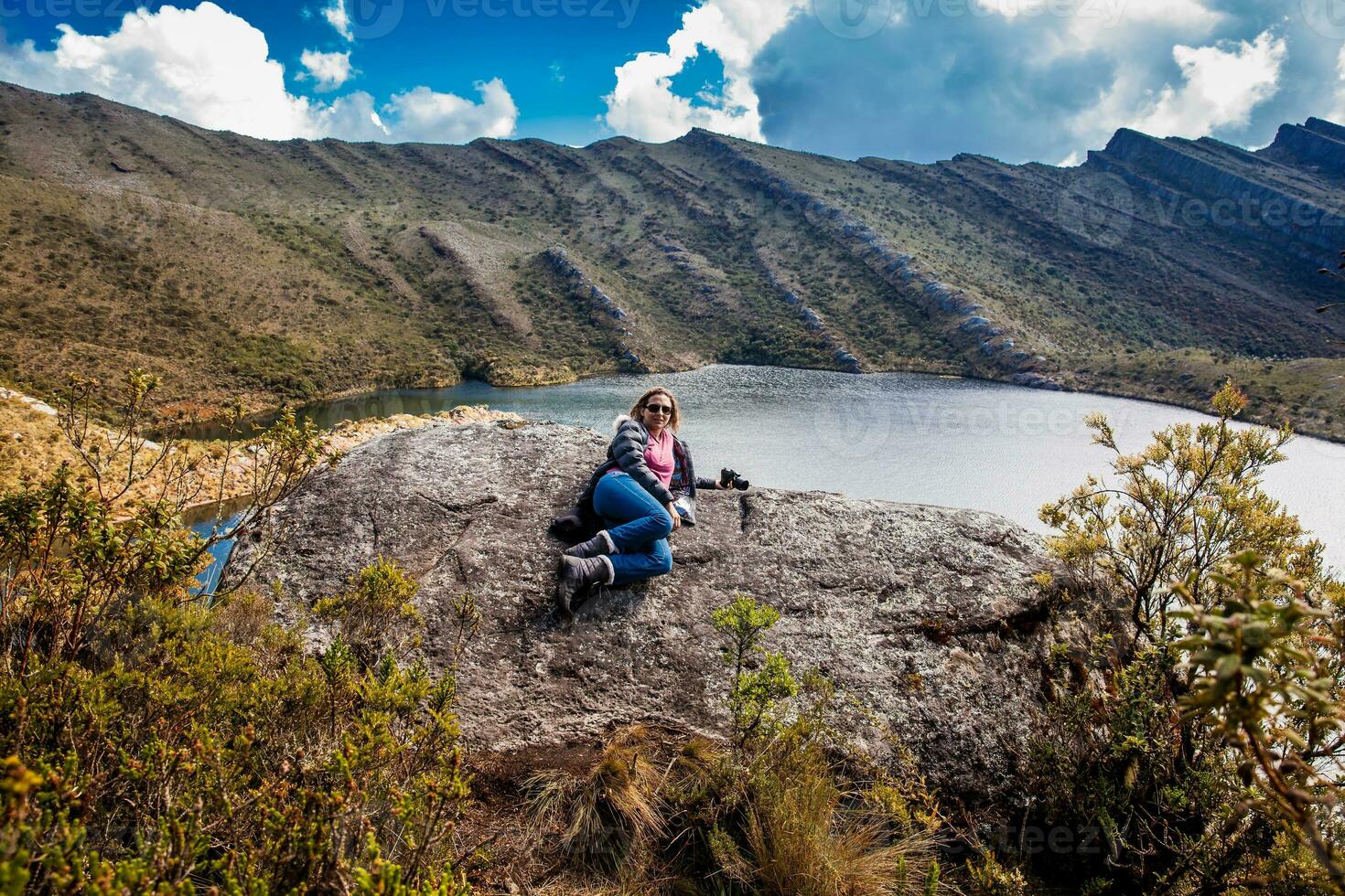 Young woman exploring the nature of a beautiful paramo at the department of Cundinamarca in Colombia photo