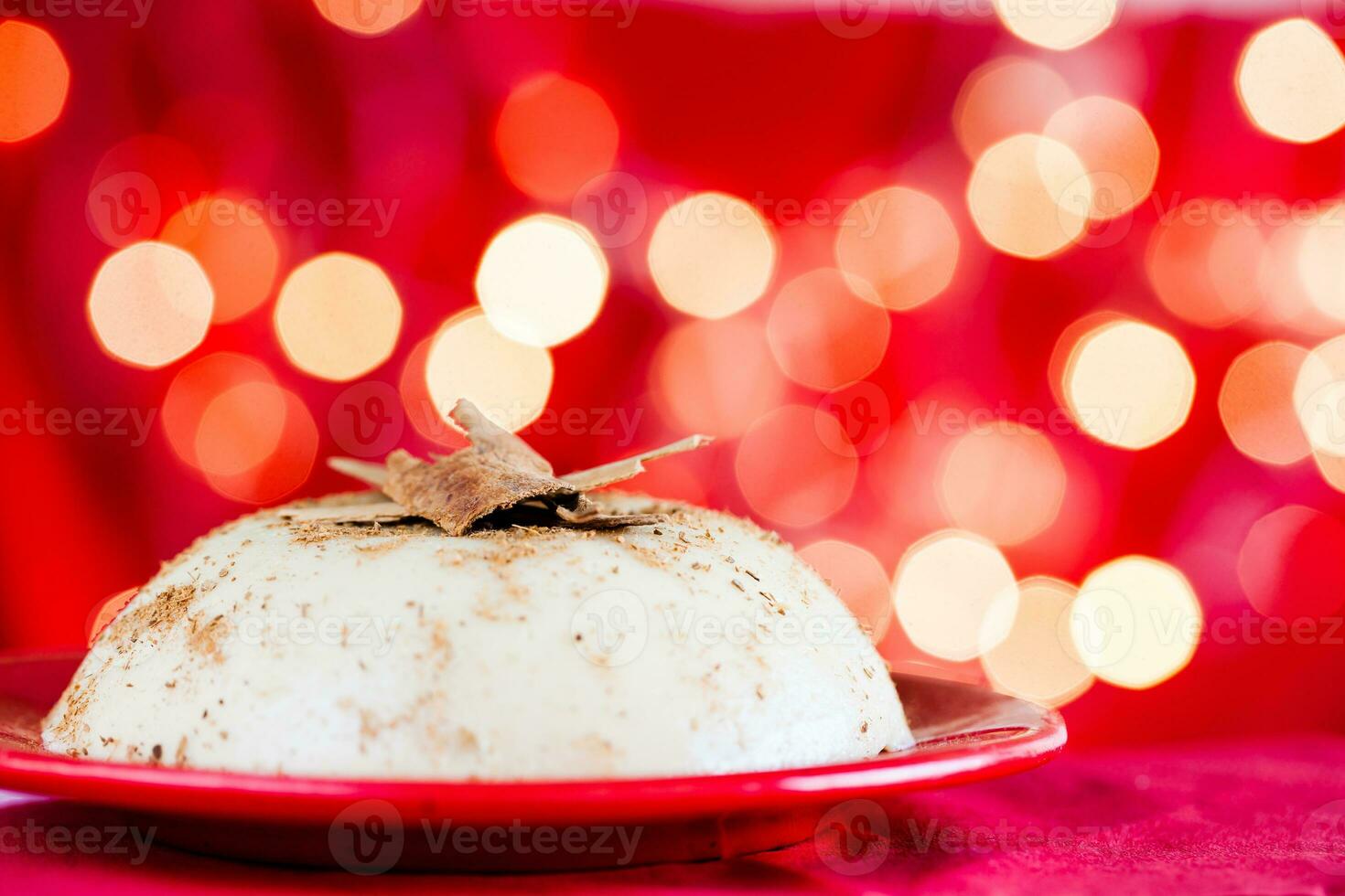 Traditional Colombian natilla on christmas red background photo