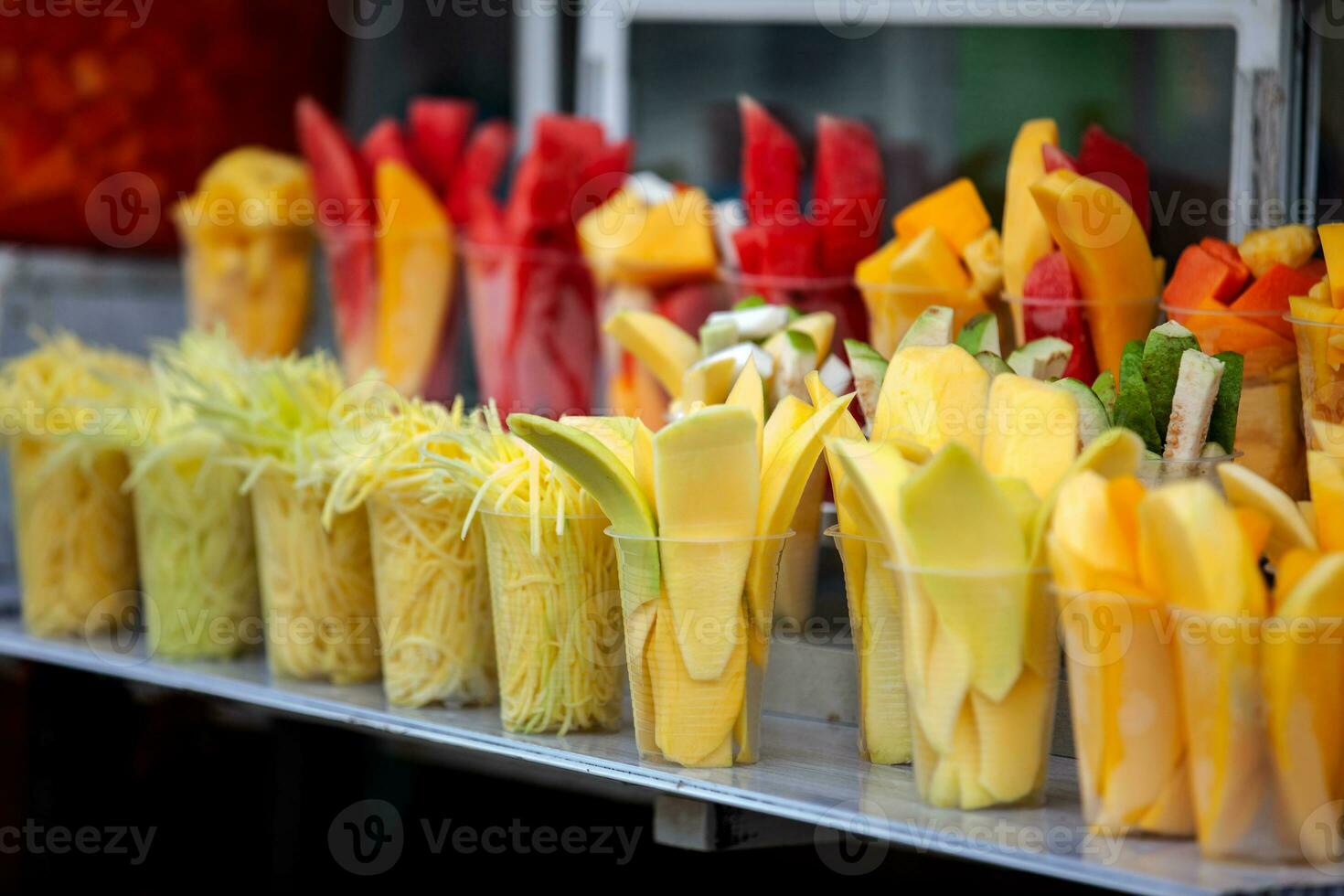 Street sell of mango and other fruits at the beautiful streets of Salento an small town located at the Quindio region in Colombia photo