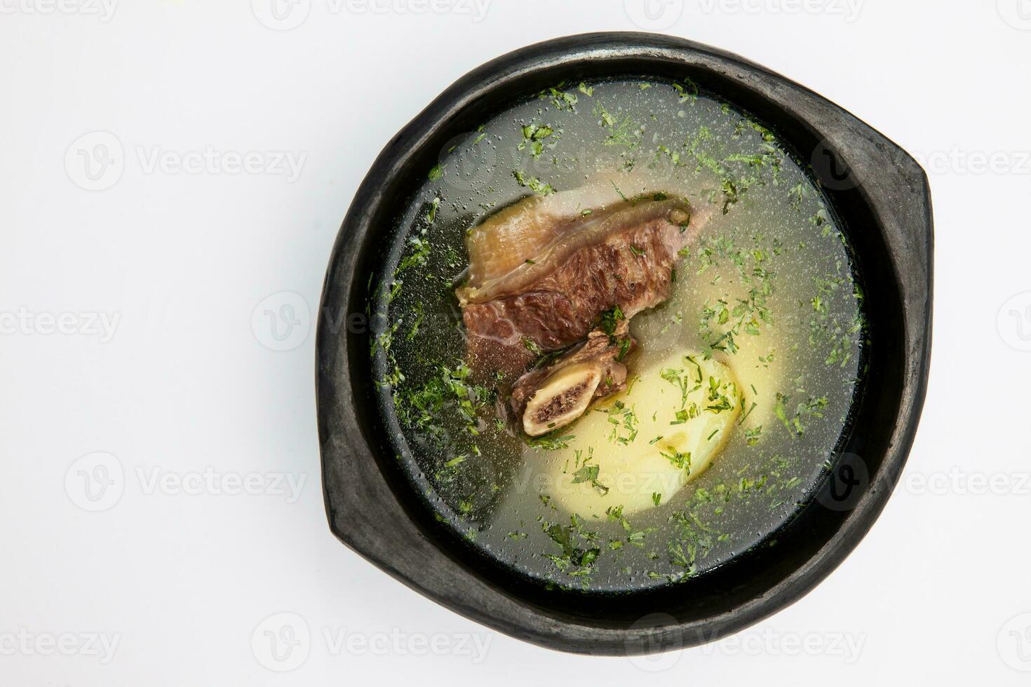 Traditional Colombian beef rib broth isolated on white background photo