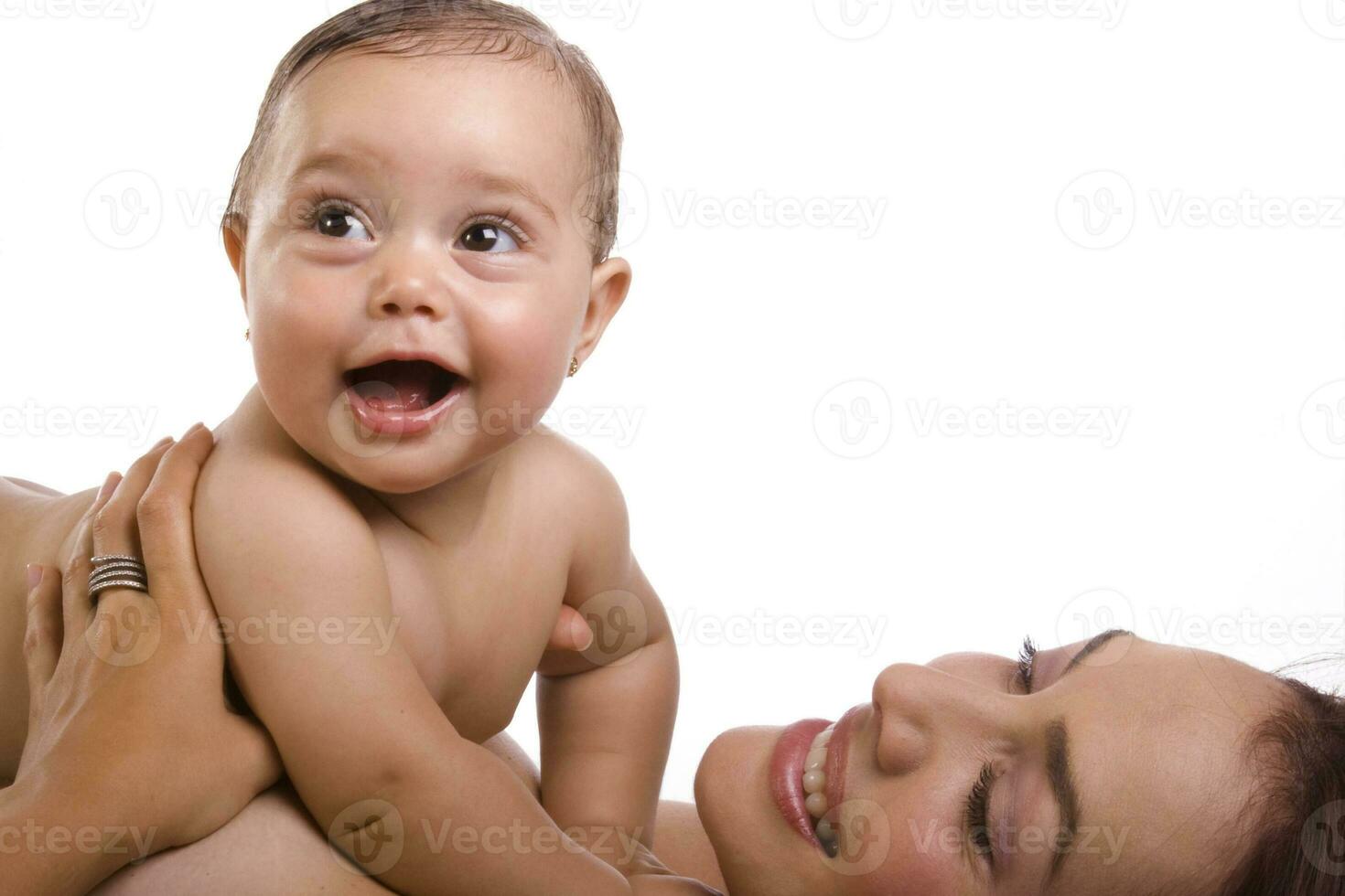 Happy beautiful young mother and her baby girl on white background photo