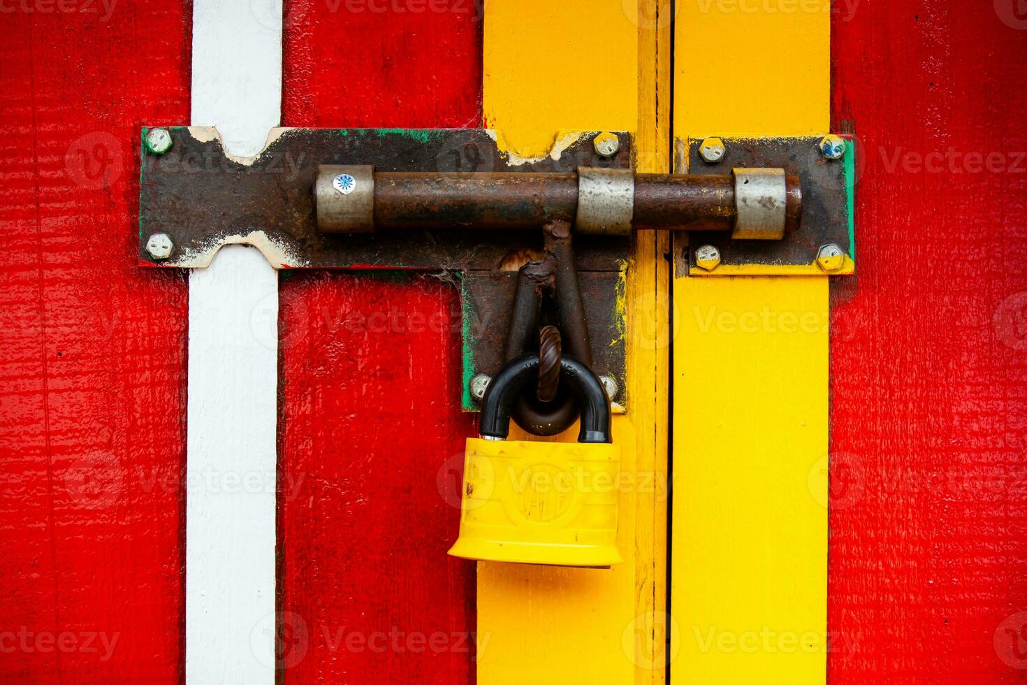 Colorful painted door with a closed lock at the small town of Salento in Colombia photo