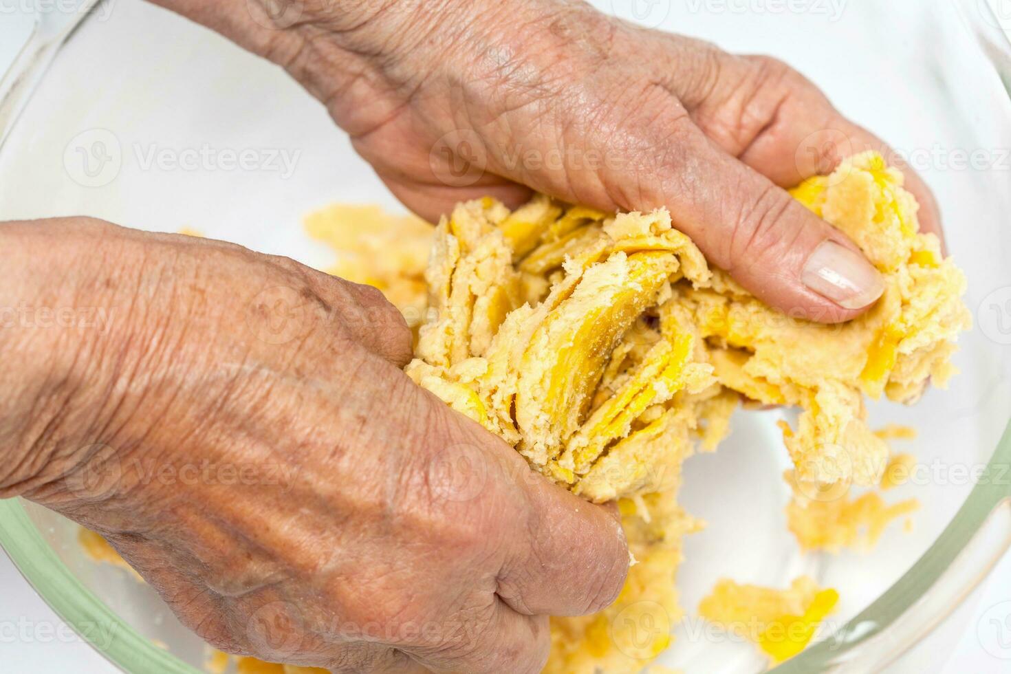 Preparation of plantain dough. Preparation of plantain croquettes stuffed with pork cracklings. Marranitas or puerquitas. photo