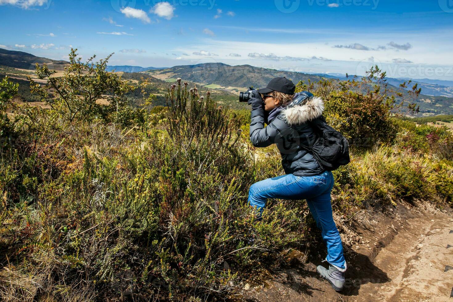 Young woman exploring the nature of a beautiful paramo at the department of Cundinamarca in Colombia photo