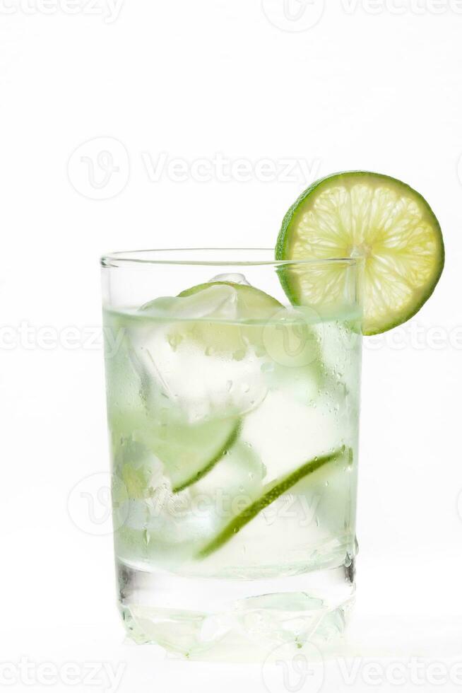 Glass of cold lemonade isolated on white background photo