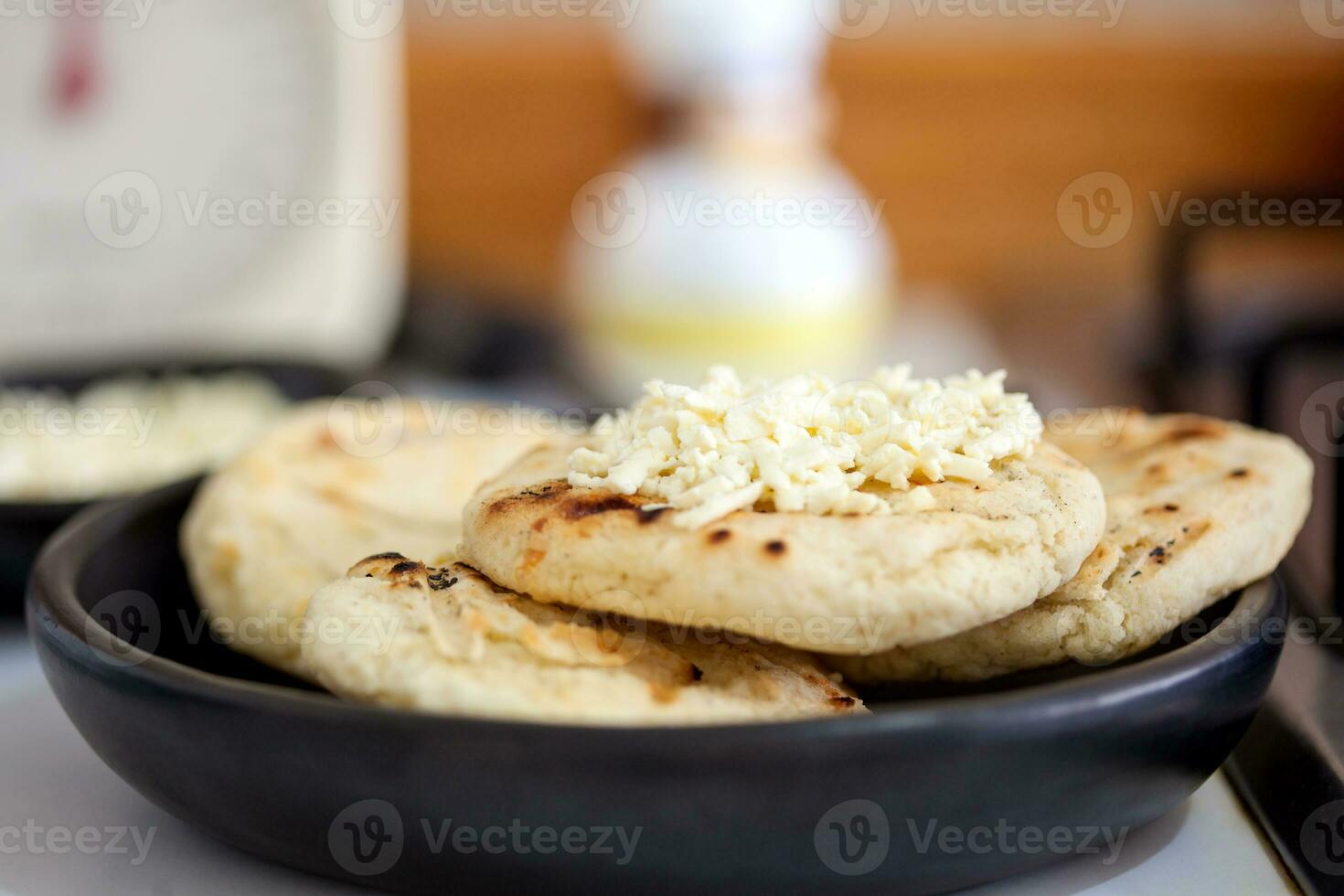 Traditional Colombian white corn arepa with cheese photo