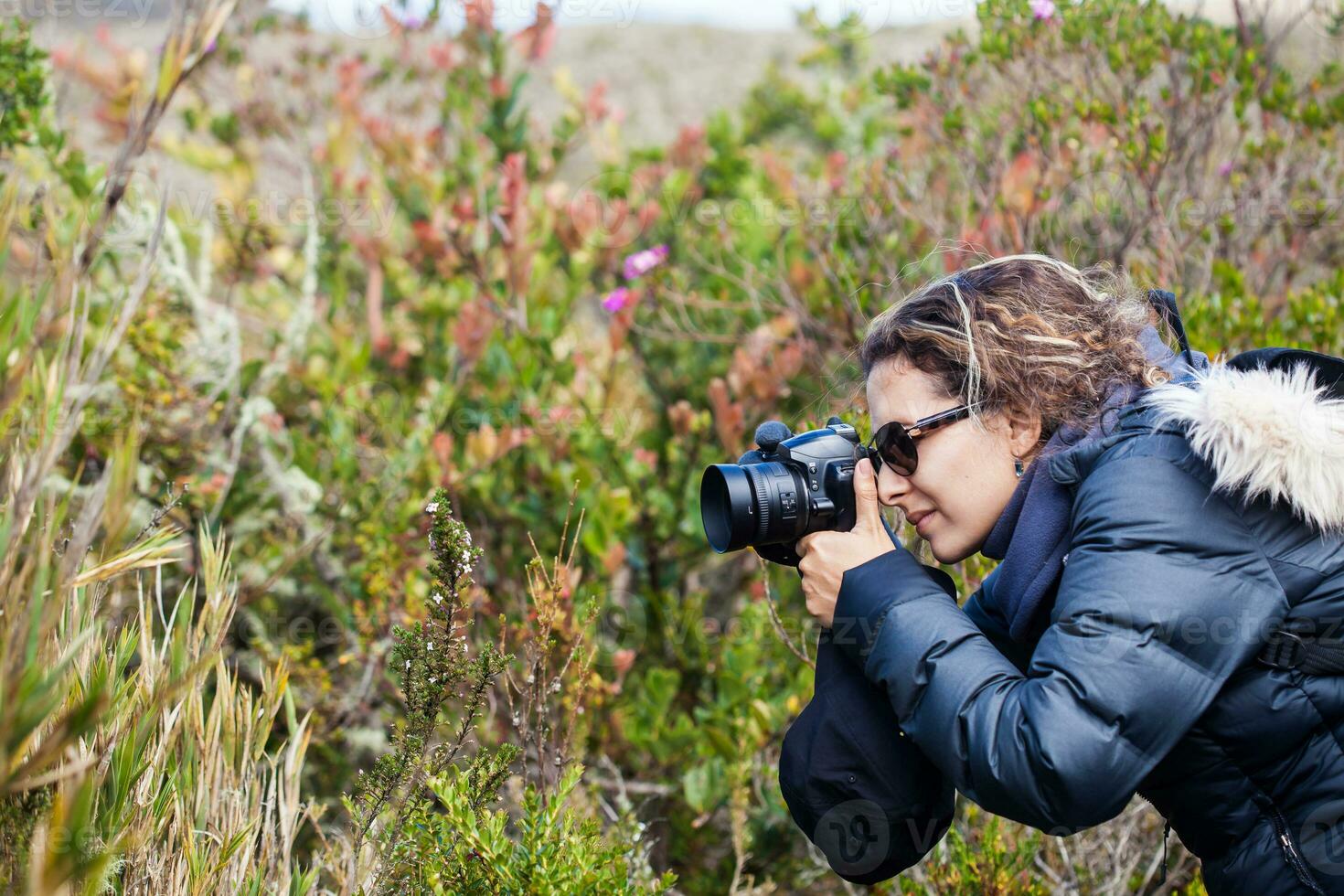 Young woman exploring the nature of a beautiful paramo at the department of Cundinamarca in Colombia photo