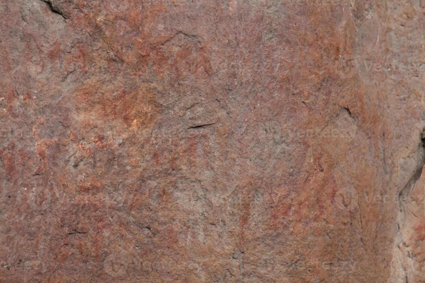Prehistoric paintings on rock known as petroglyphs in Colombia photo
