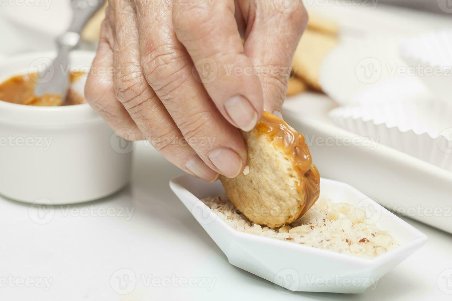 Adding nuts to cookies edge photo