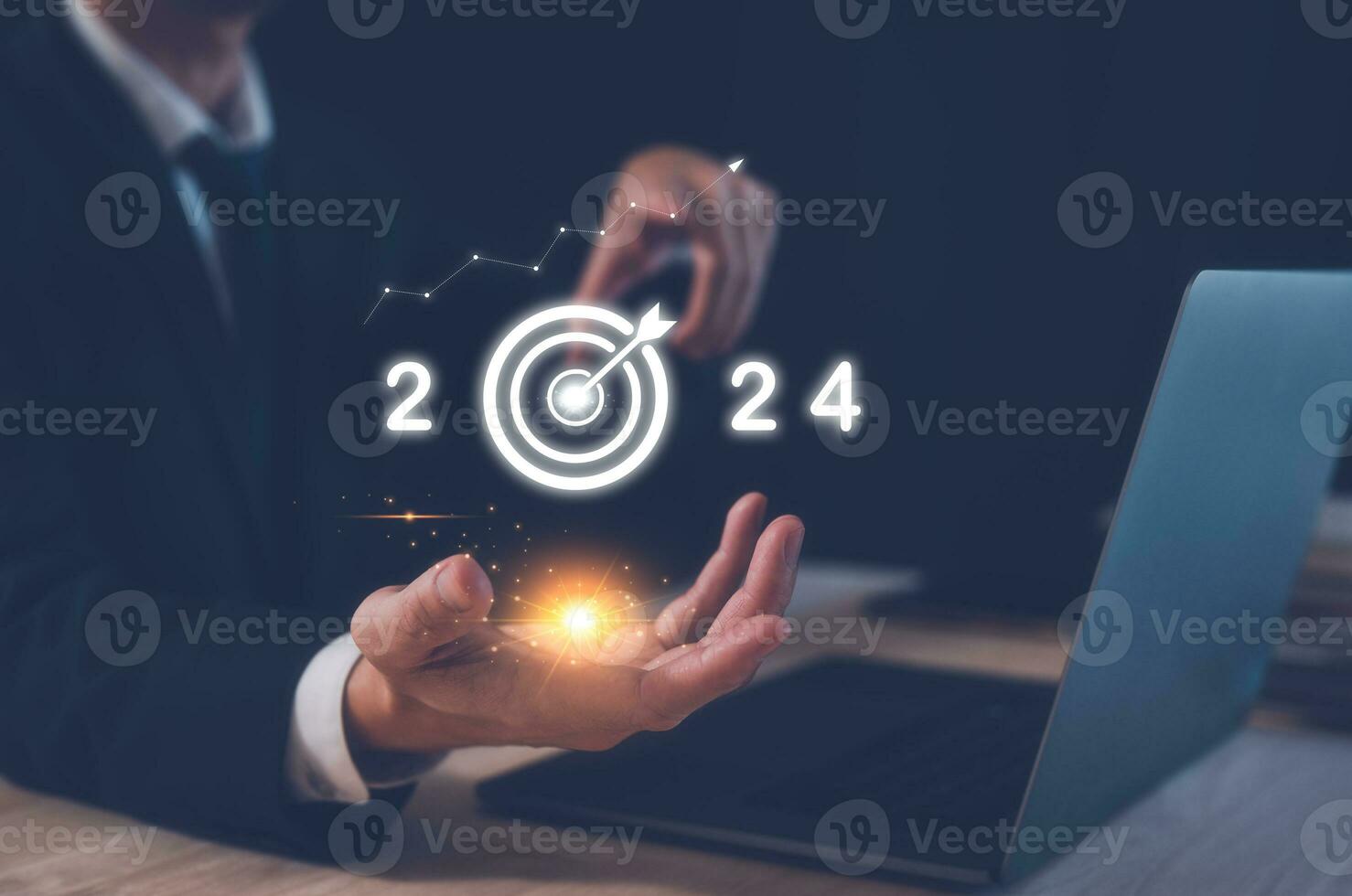 2024 business planning and strategy concept, businessman holding virtual icon of the year 2024 target darts, marketing financial and research analysis, investment trends next new year photo