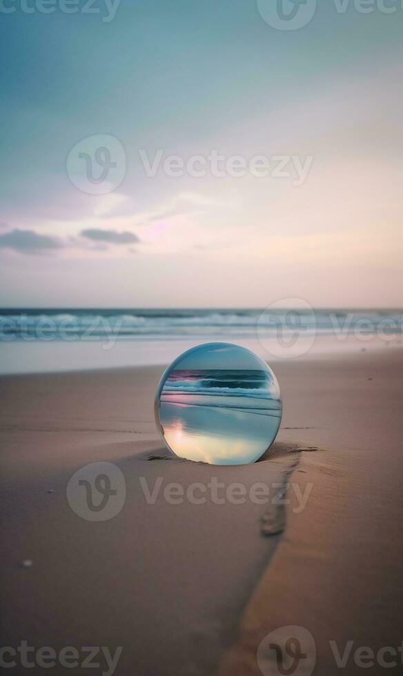 A Mirror On The Beach With The Sun Setting Behind It photo