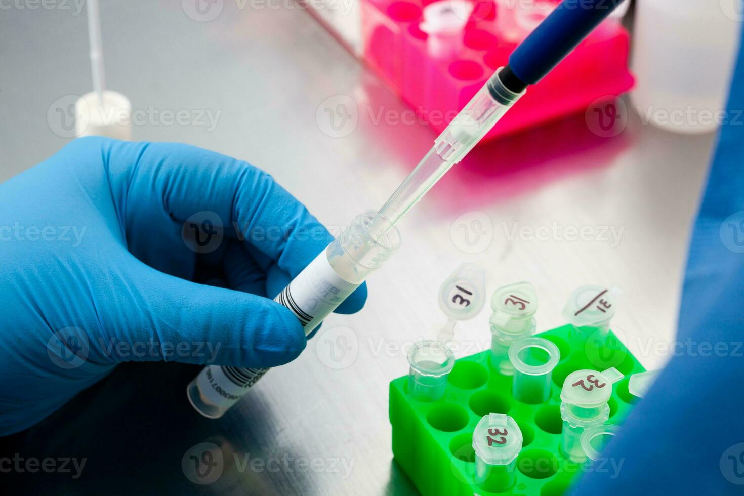 Closeup of a scientist extracting DNA using the spin column-based nucleic acid purification technique. Spin column-based nucleic acid purification technique. Diagnosis of human papillomavirus virus. photo