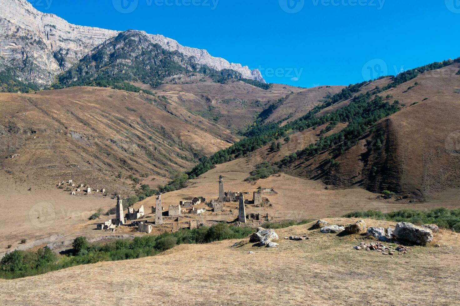 Old Targim towers complex, one of the largest medieval castle-type tower villages, located on the extremity of the mountain range in Ingushetia, Russia. photo