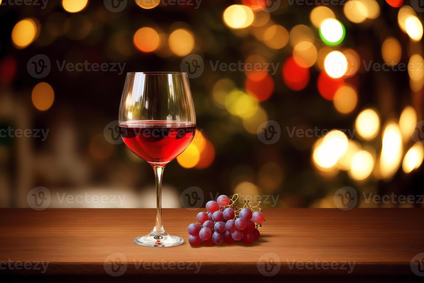 Glass of red wine and grapes on a wooden table.Bottle and glass of red wine with grapes. photo