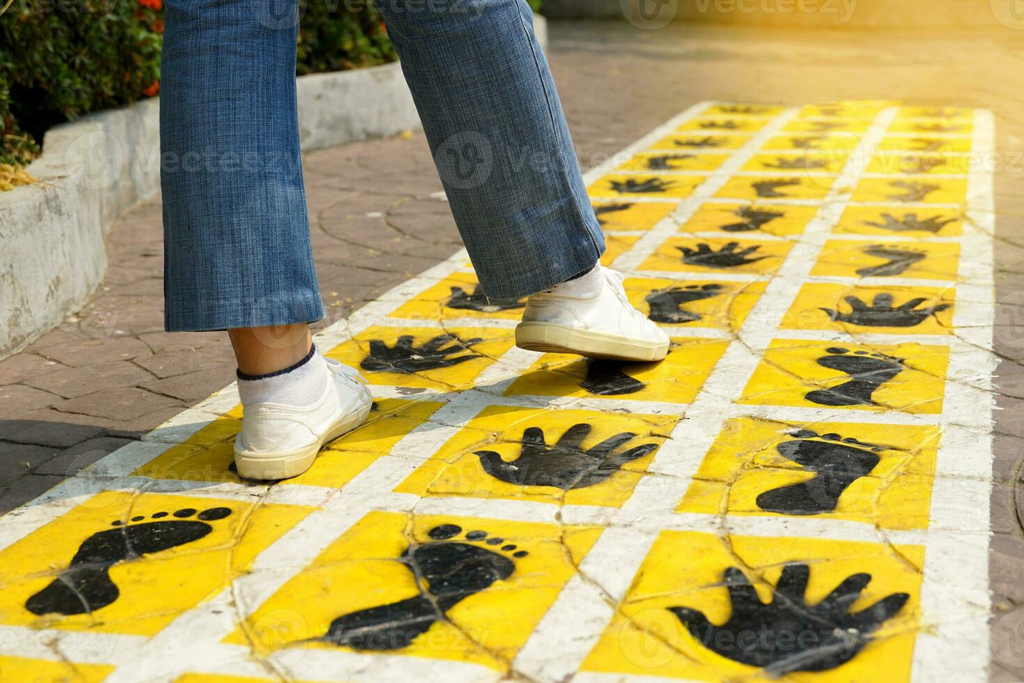 Follow the footsteps marked on the walkway compare footsteps It is a record of the virtue of a person who struggled. Overcome obstacles straight forward leaving traces for others to see and remember. photo