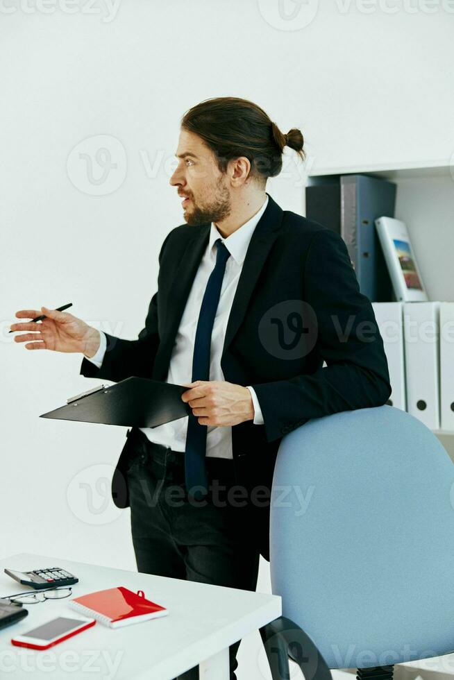 manager in the office with documents executive photo
