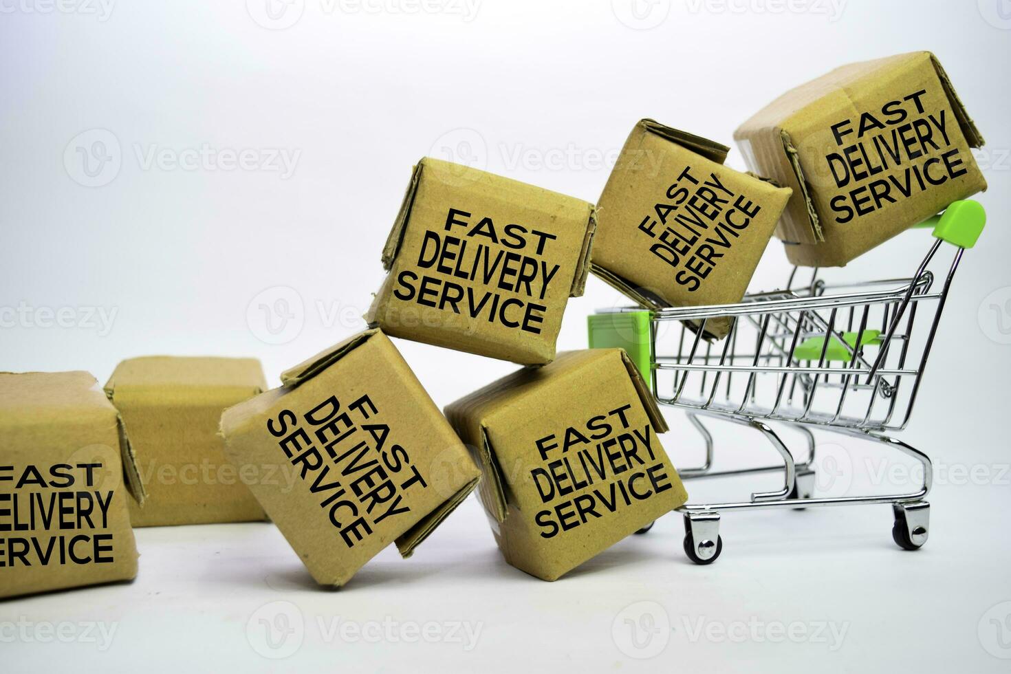 Fast Delivery Service Text in small boxes and shopping cart. Concepts about online shopping. Isolated on white background photo
