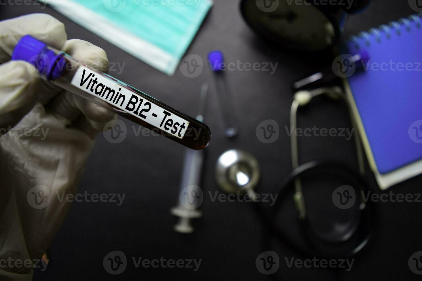 Vitamin B12 Test with blood sample. Top view isolated on black