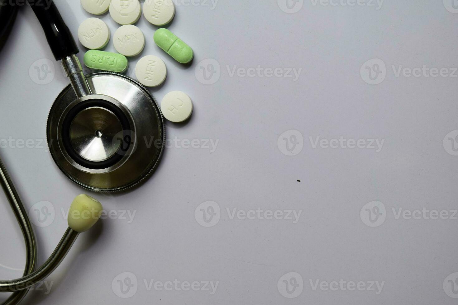 Medicine stethoscope and different tablet pills. Healthcare or Medical concept. photo