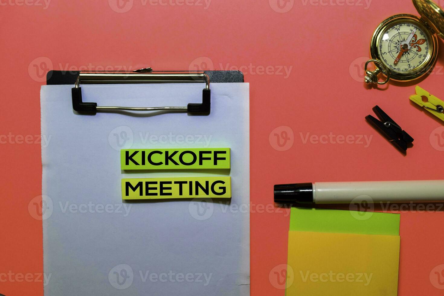 Kickoff Meeting write on sticky notes isolated on Pink background. photo