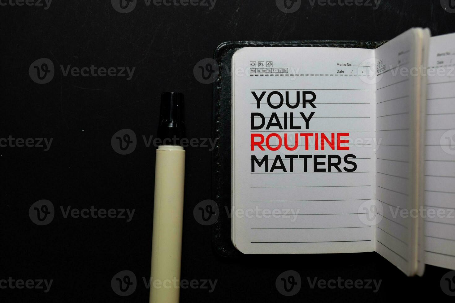 Your Daily Routine Matters. write on a book isolated on office desk photo