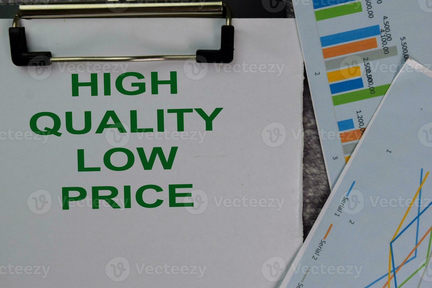 High Quality Low Price text write on a paperwork isolated on office desk. photo