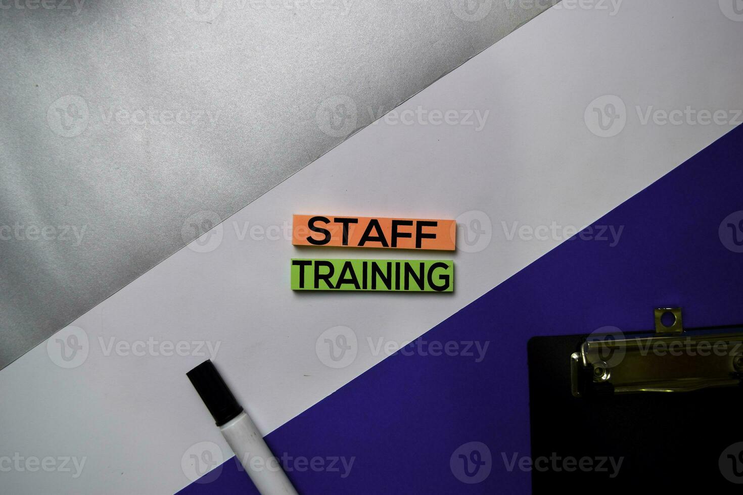 Staff Training text on sticky notes with color office desk concept photo