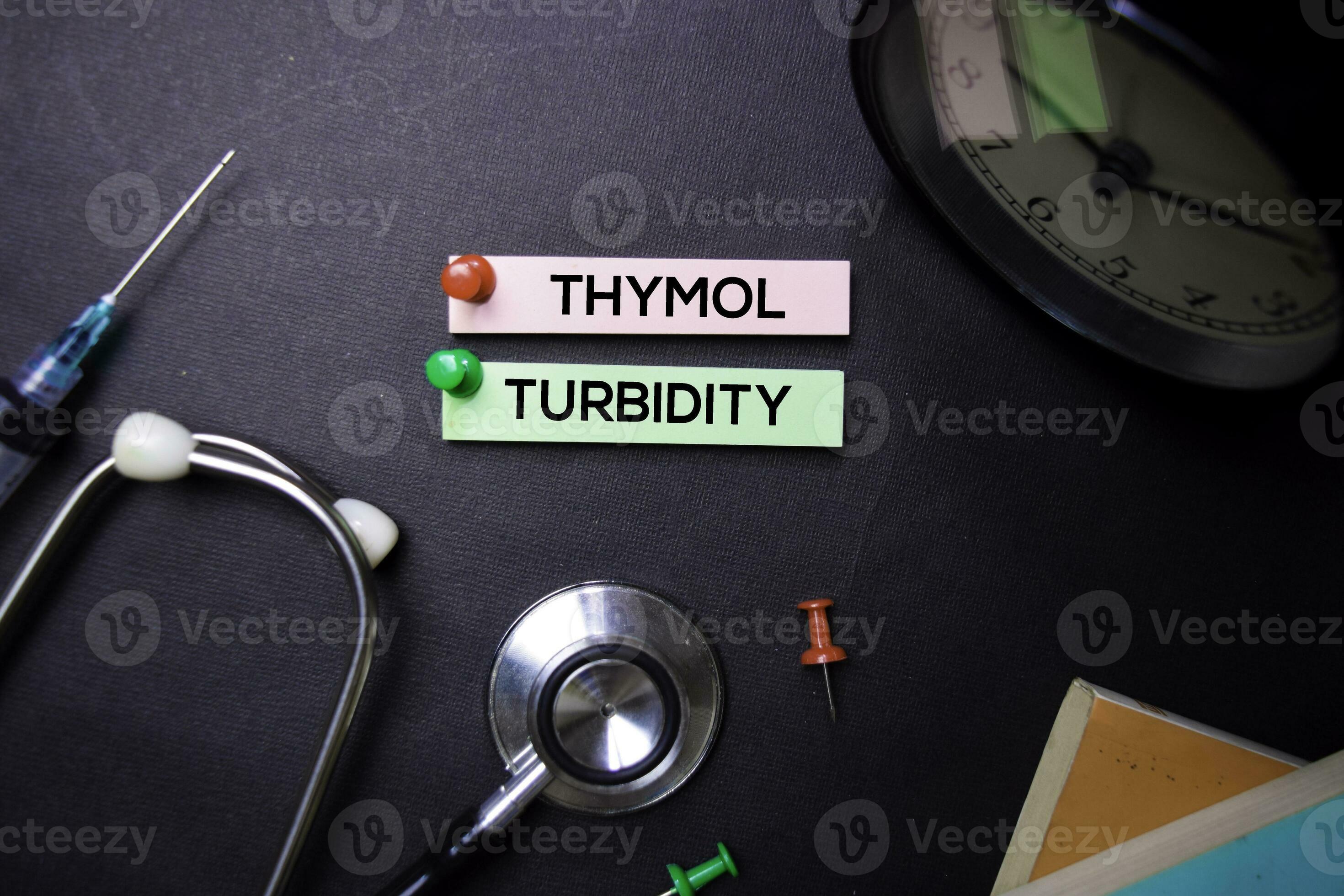 Thymol Turbidity text on Sticky Notes. Top view isolated on black