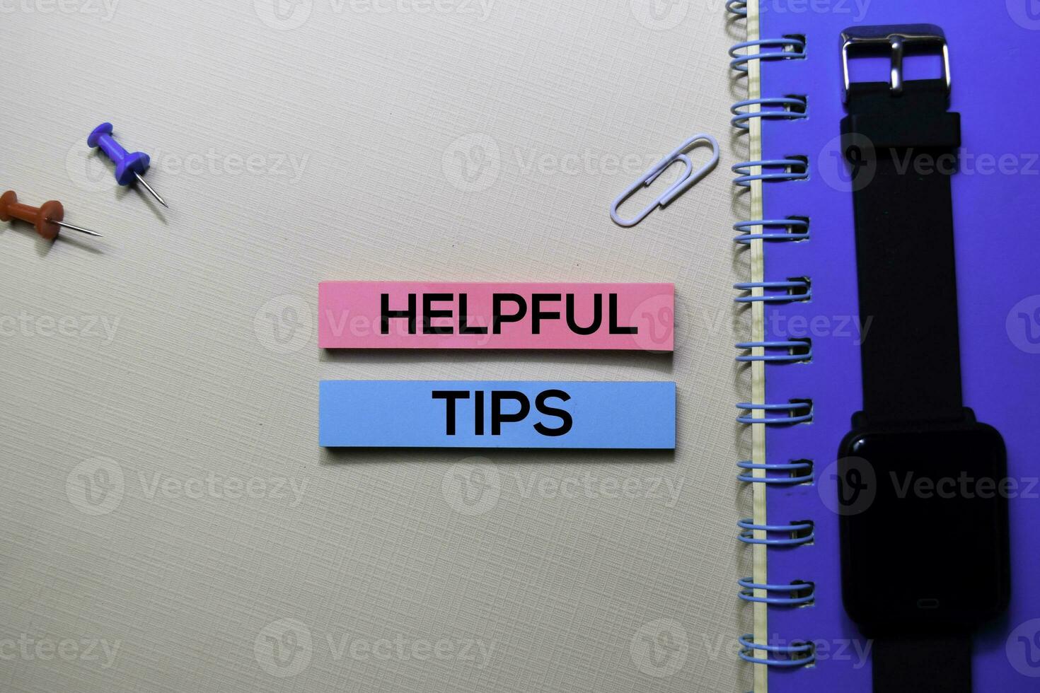 Helpful Tips text on sticky notes isolated on office desk photo