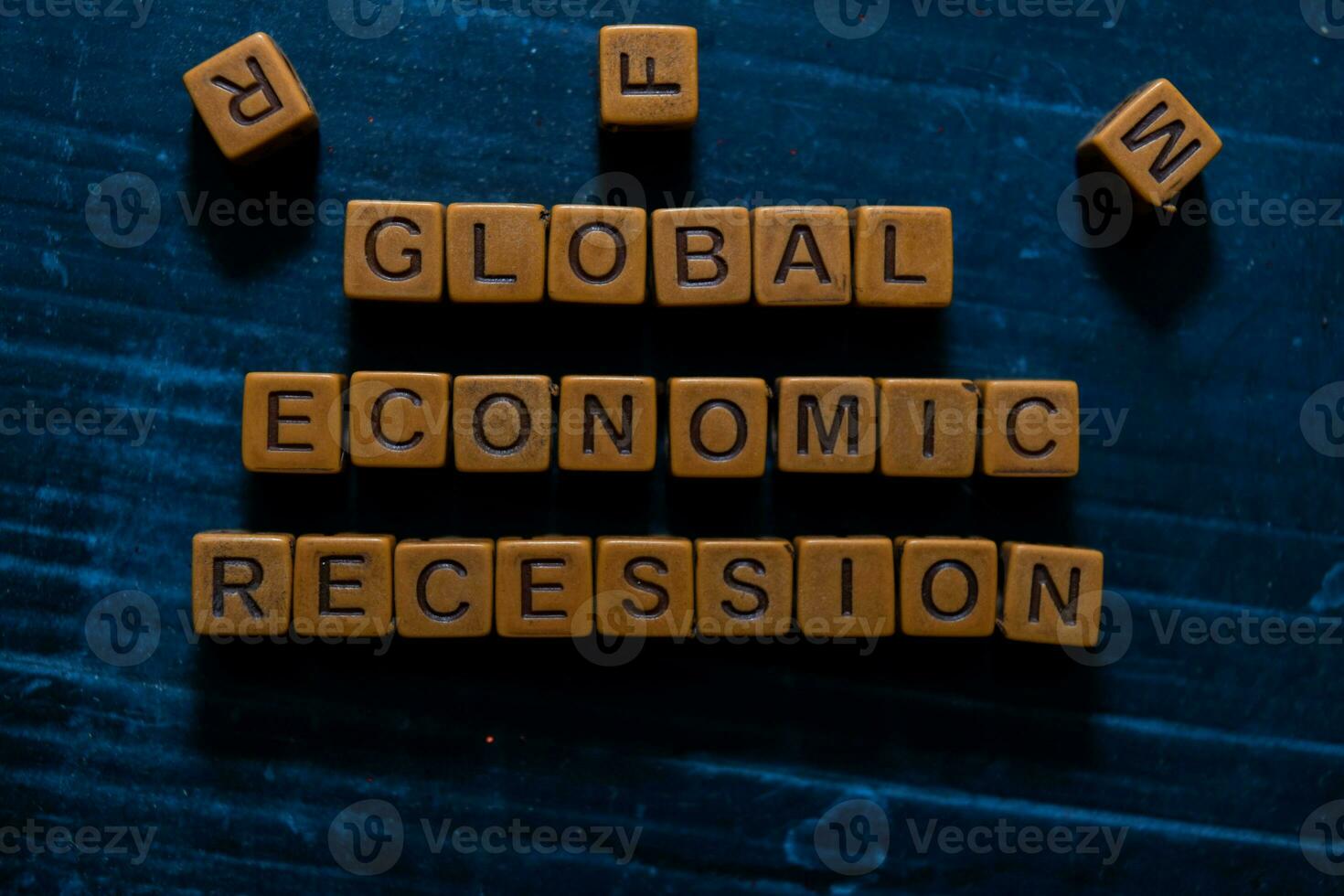 Global Economic Recession on wooden cubes. On table background photo