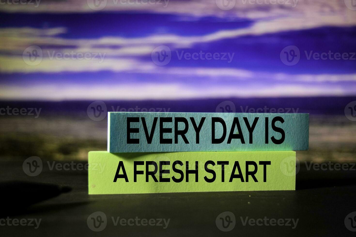 Every Day Is A Fresh Start on the sticky notes with bokeh background photo