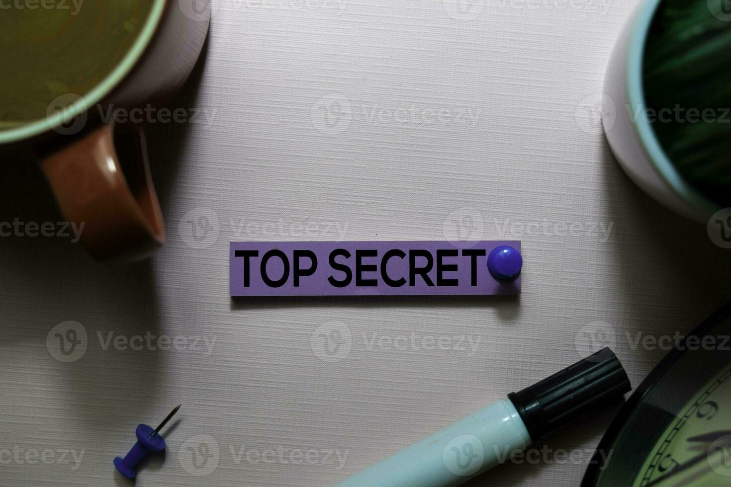 Top Secret text on sticky notes isolated on office desk photo